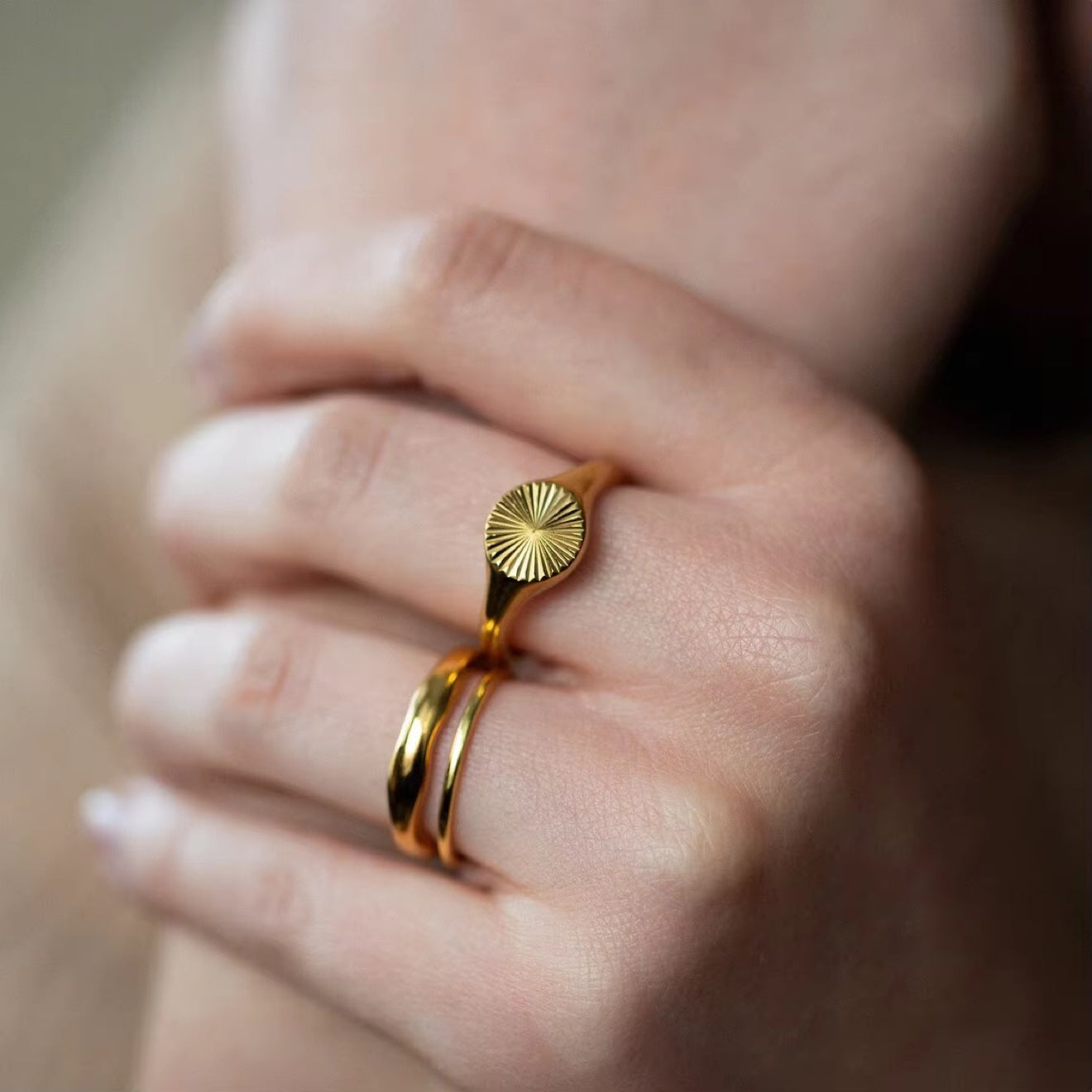 Sunburst Signet Ring worn on finger