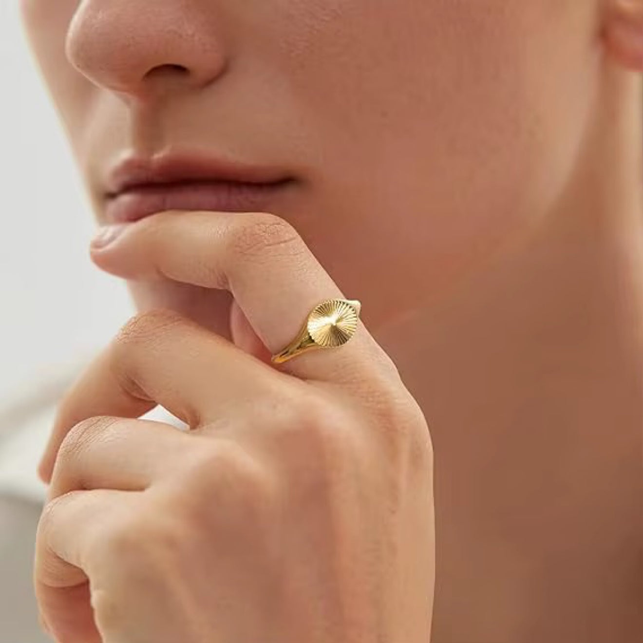 Sunburst Signet Ring on pinky finger